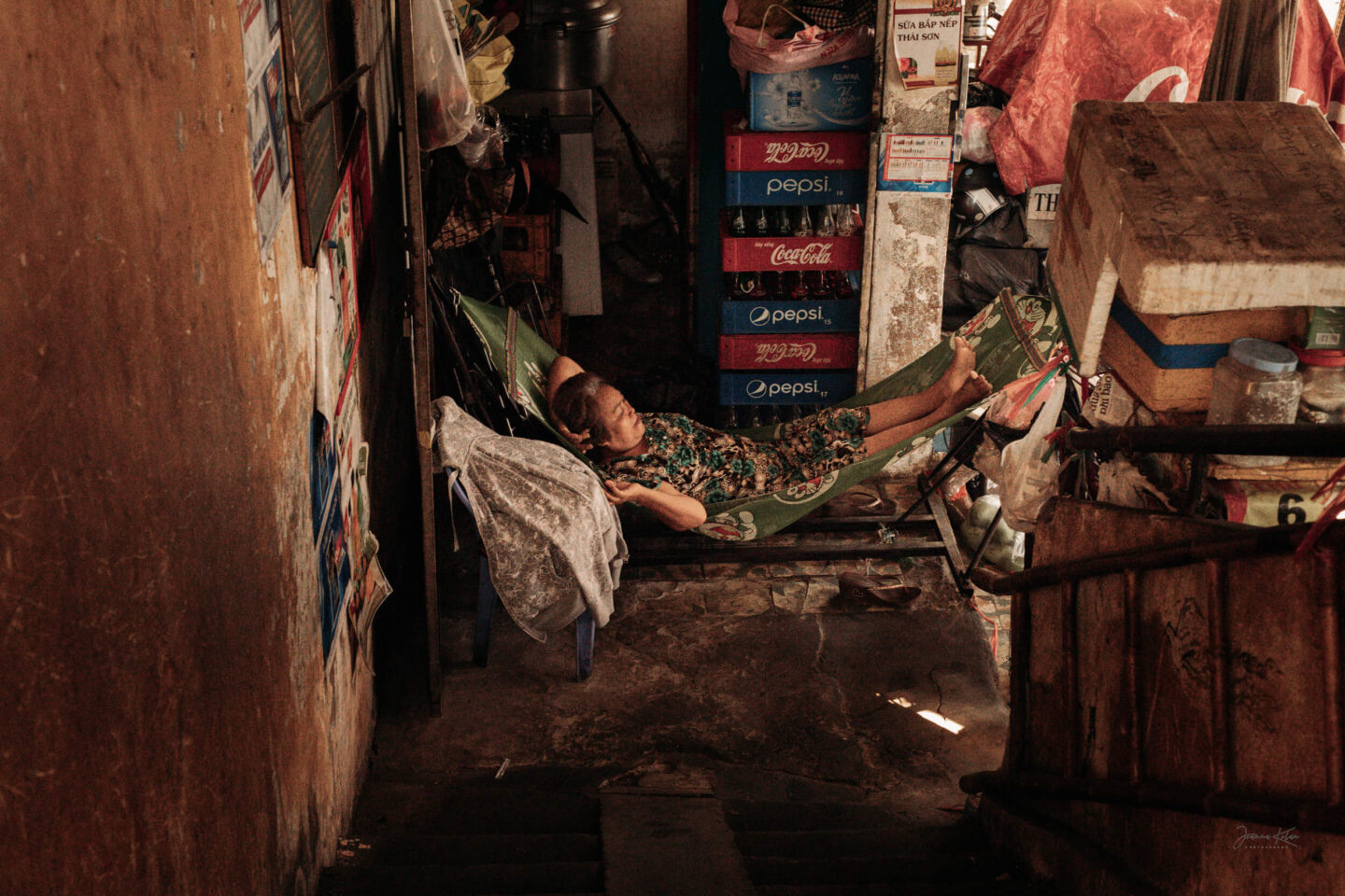 A woman takes a rest in a hammock in the communal space of a condominium in Ho Chi Minh City, Southeast Vietnam.