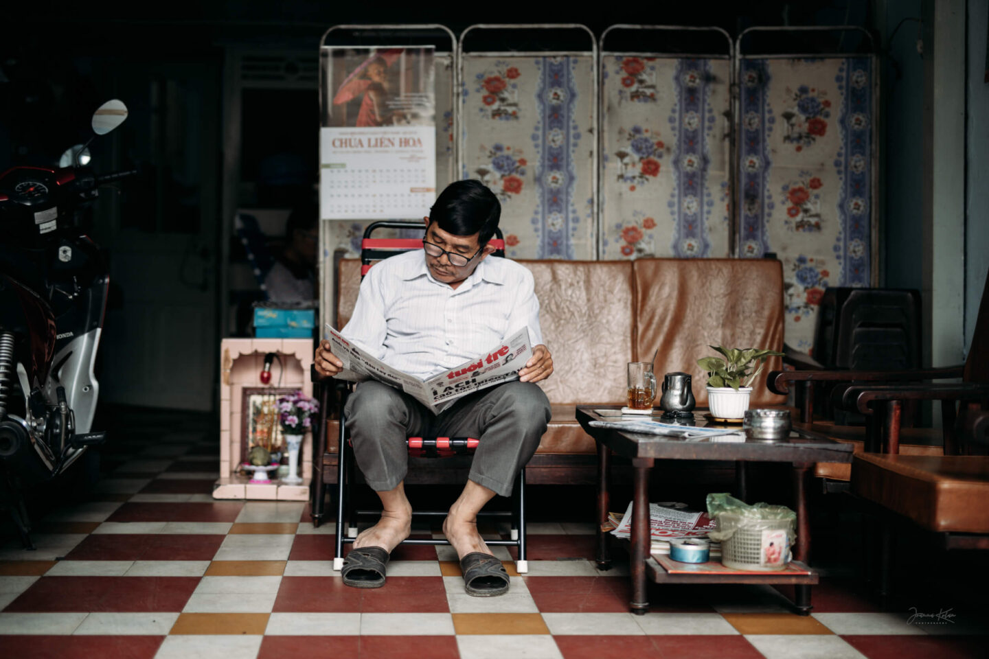 A man reading a newspaper in Ho Chi Minh City, Southeast Vietnam