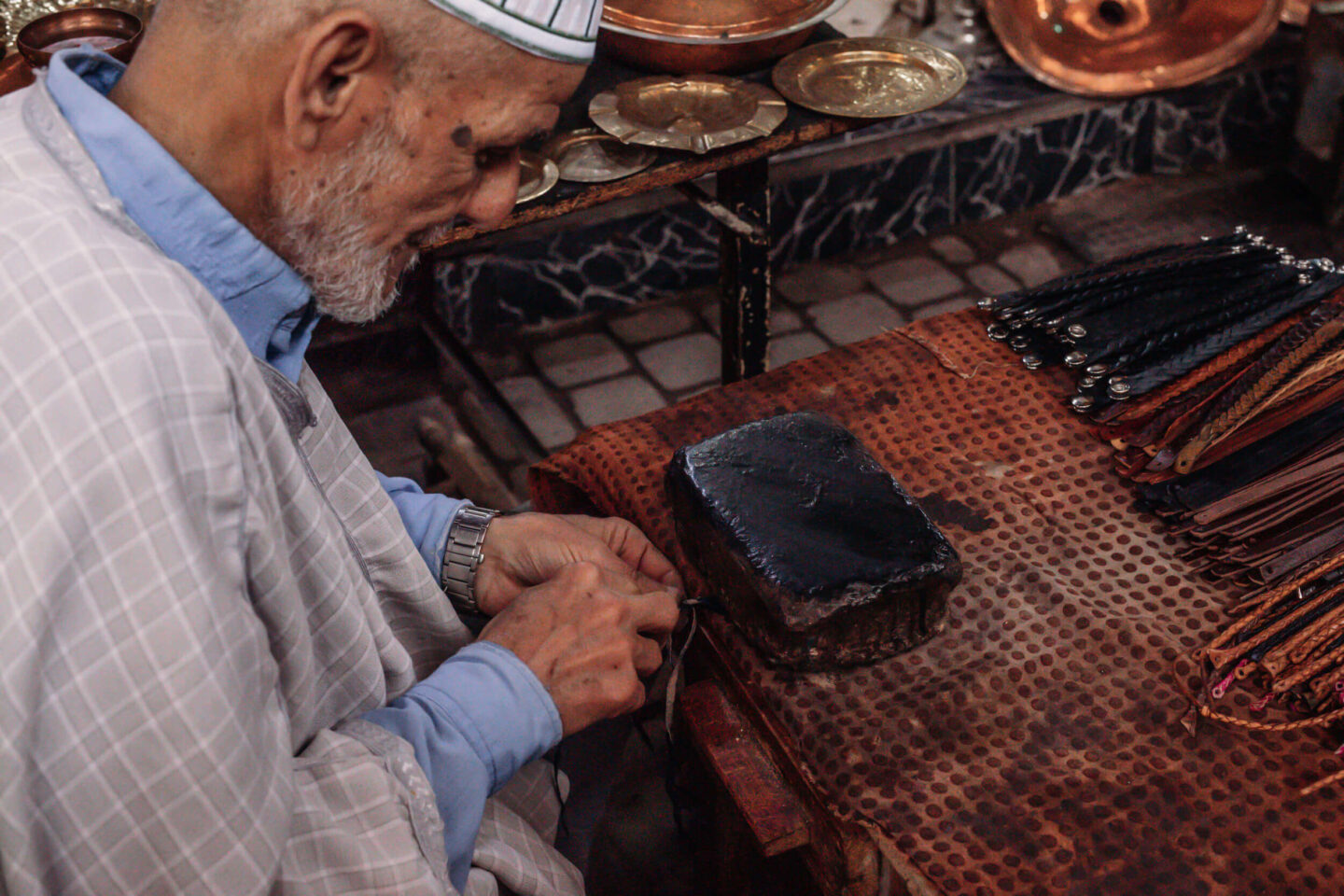 An artisan working with leather in the medina of Marrakech 